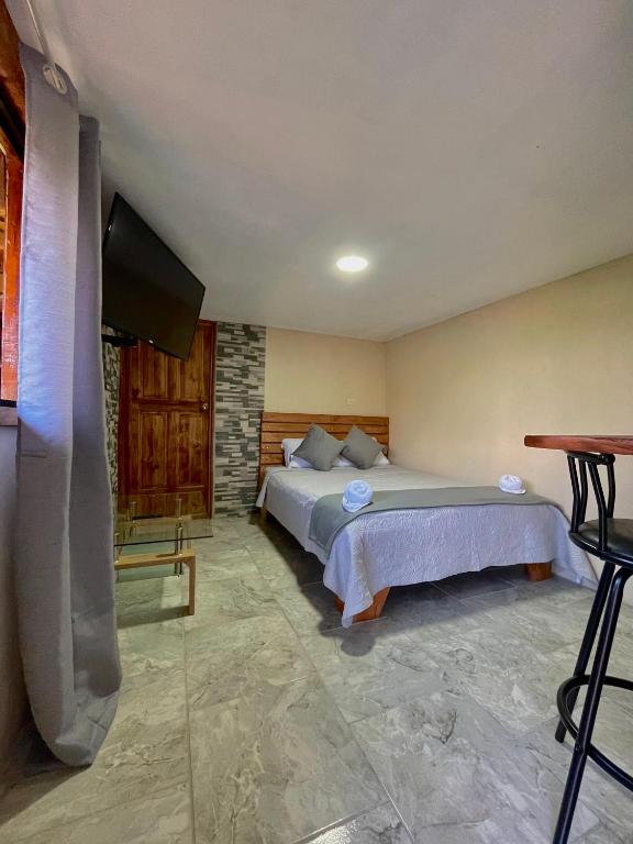 Postel nebo postele na pokoji v ubytování Dreams Lodge Orosi