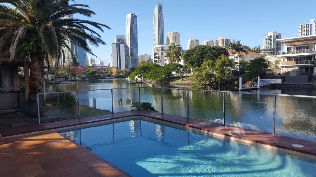 a swimming pool with a city in the background at Quiet location close to it all in Gold Coast