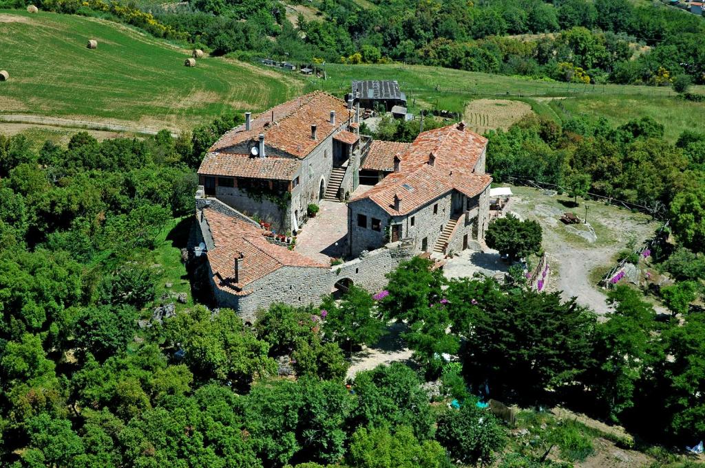 an aerial view of a large house in a field at Borgo La Civitella in Roccastrada