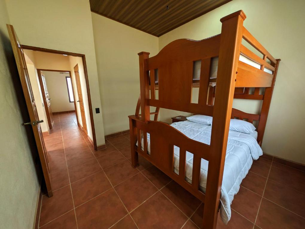 a bedroom with two bunk beds and a hallway at Casa Pura Vida Copal KiteBeach in Playa Copel