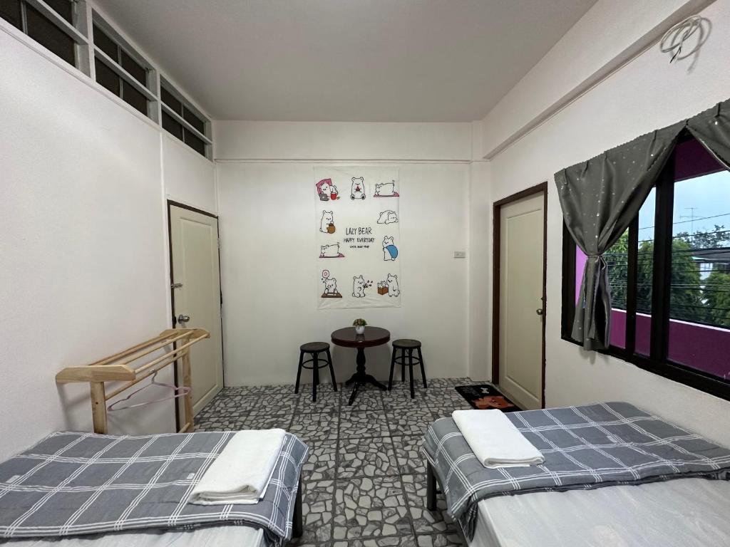 Postel nebo postele na pokoji v ubytování Madam Guesthouse