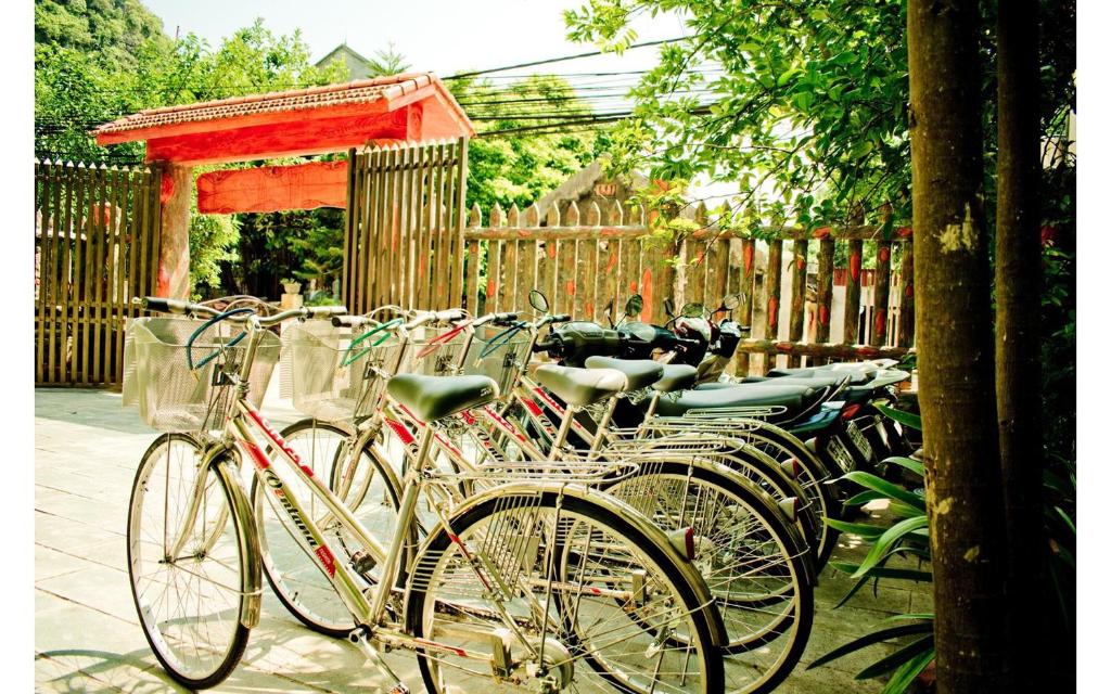 a group of bikes parked next to a fence at Trang An Mountain View Homestay in Ninh Binh