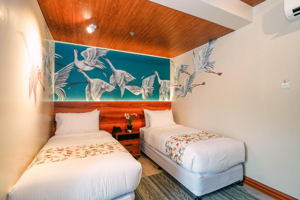 Postel nebo postele na pokoji v ubytování Hotel Kimberly Tagaytay