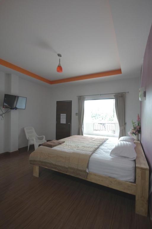 Postel nebo postele na pokoji v ubytování The shark resort ปราณบุรี