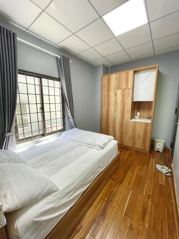 Postel nebo postele na pokoji v ubytování POTA Hotel & Apartment