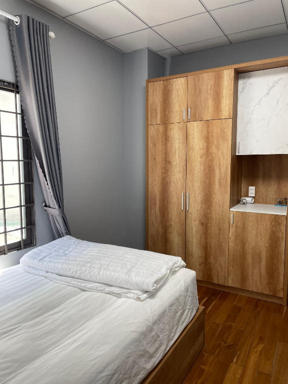 Postel nebo postele na pokoji v ubytování POTA Hotel & Apartment