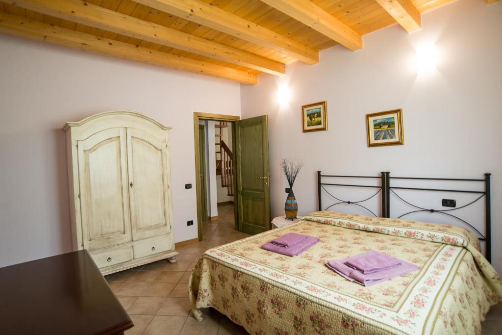 Postel nebo postele na pokoji v ubytování Case Vacanza Orchidea