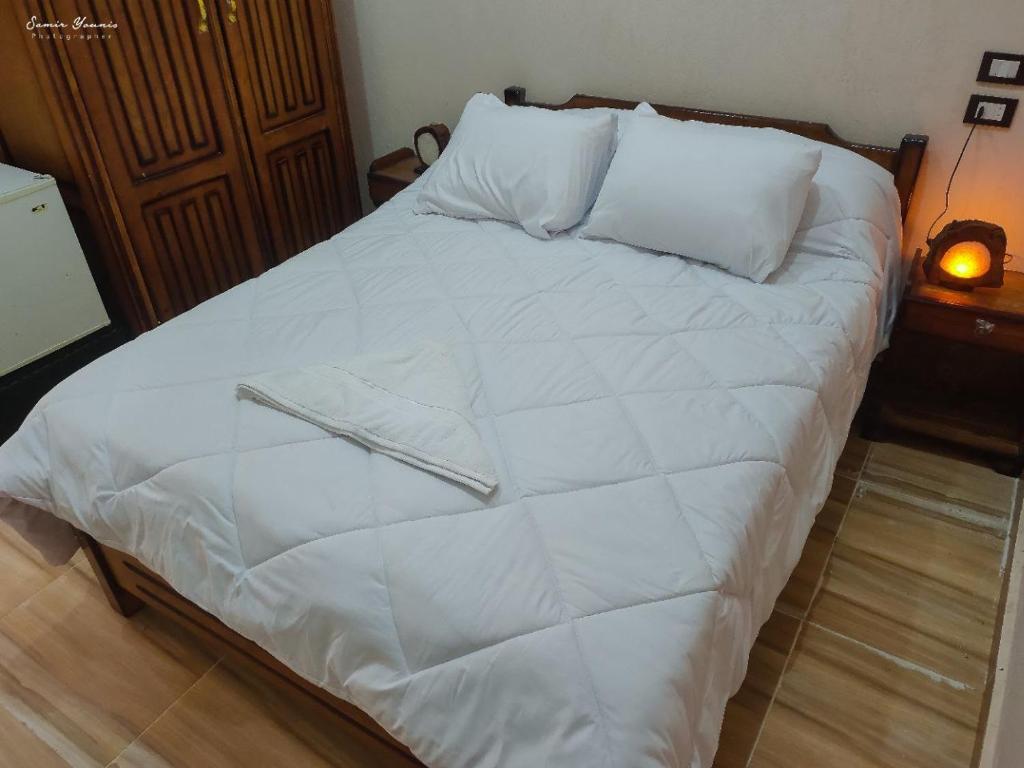 Postel nebo postele na pokoji v ubytování amzran hotel siwa