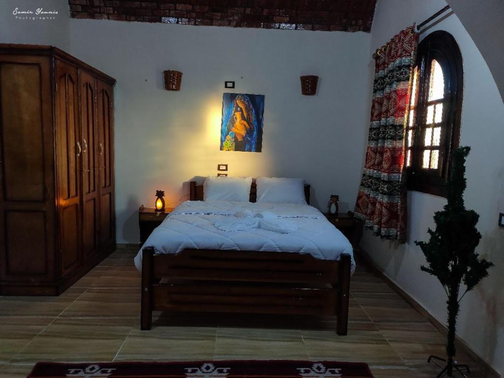 Postel nebo postele na pokoji v ubytování amzran hotel siwa