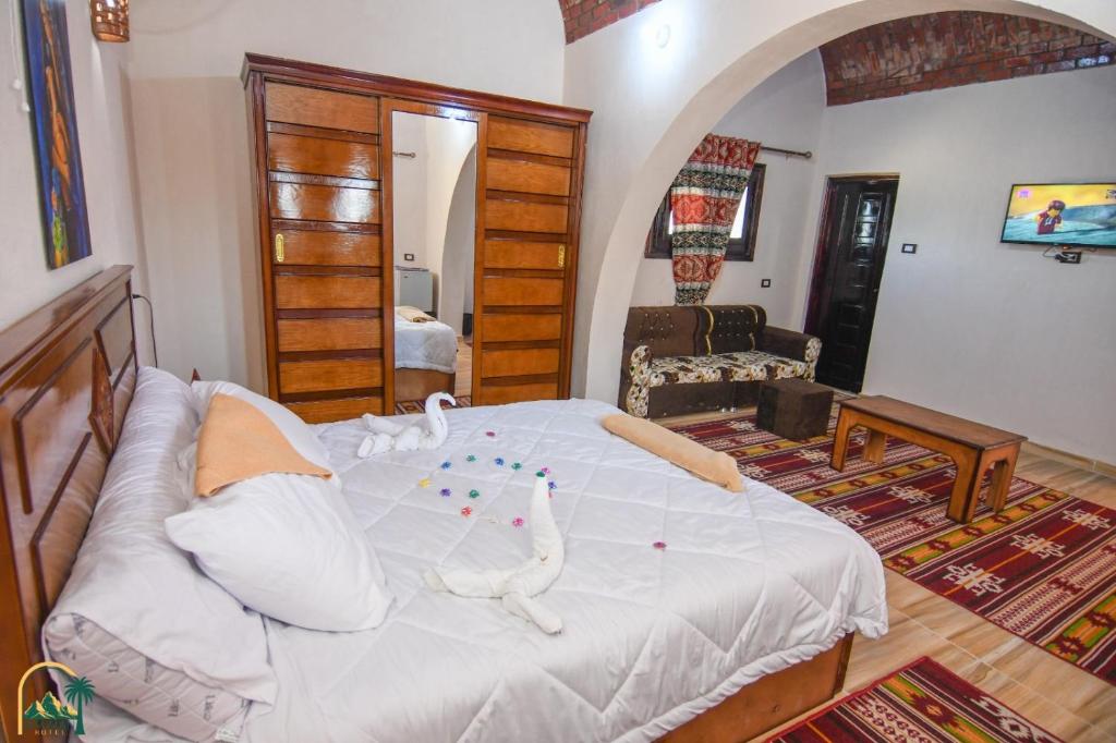 Postel nebo postele na pokoji v ubytování amzran hotel siwa