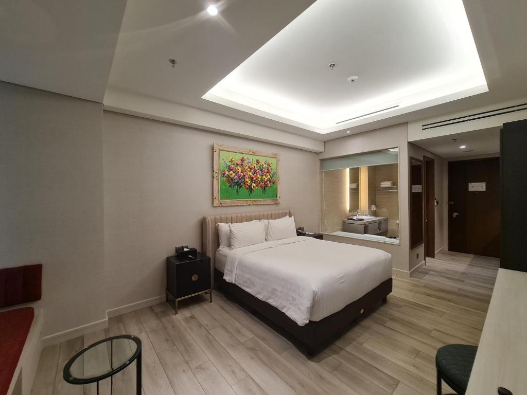 Ένα ή περισσότερα κρεβάτια σε δωμάτιο στο Trembesi Hotel