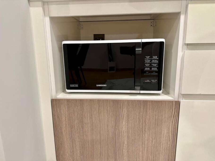 TV a/nebo společenská místnost v ubytování Astra sky river High floor,3 bedrooms 97㎡ 山景房带浴缸