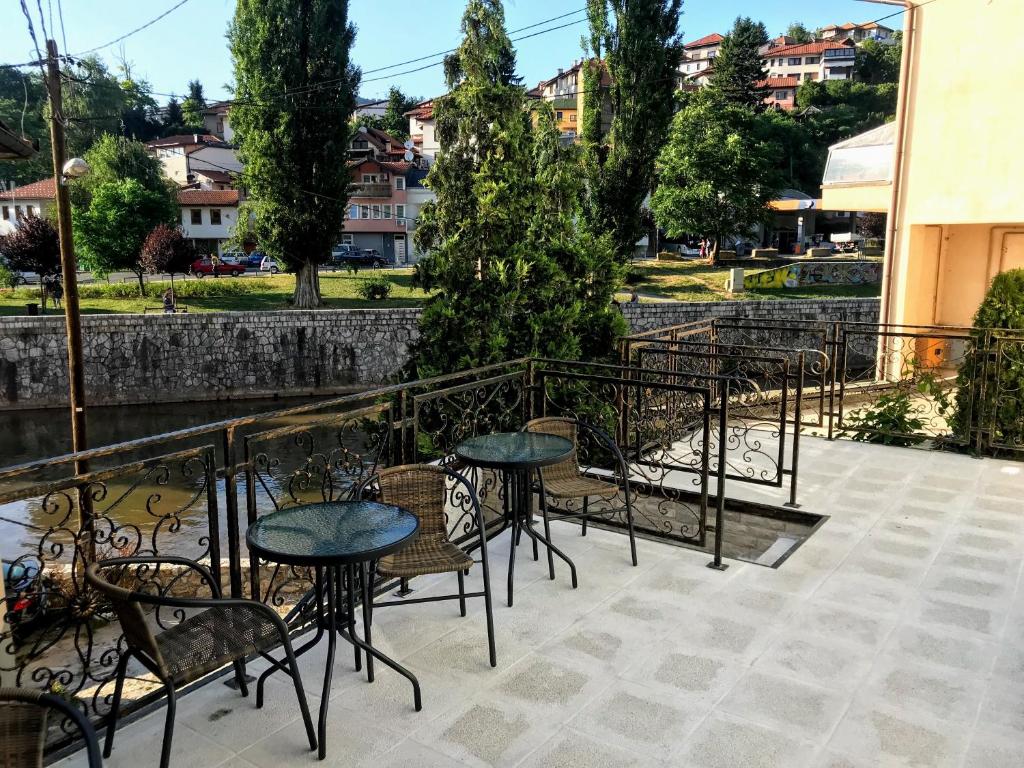 a group of tables and chairs on a patio at Apartmani Zaara in Sarajevo