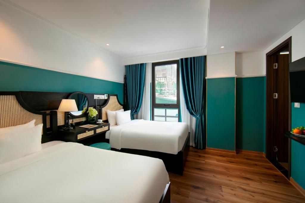 Postel nebo postele na pokoji v ubytování Hotel De Rond