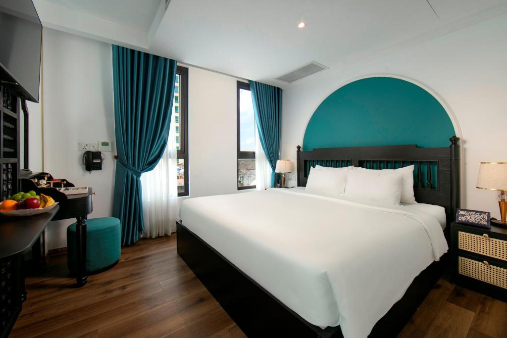 Postel nebo postele na pokoji v ubytování Hotel De Rond