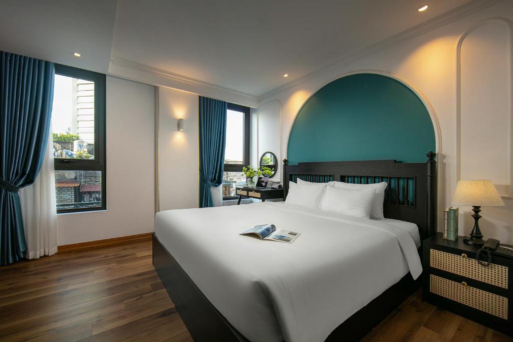 Postel nebo postele na pokoji v ubytování Hotel De Rond
