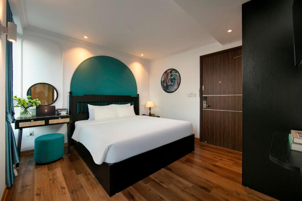 Postel nebo postele na pokoji v ubytování Hotel De Rond