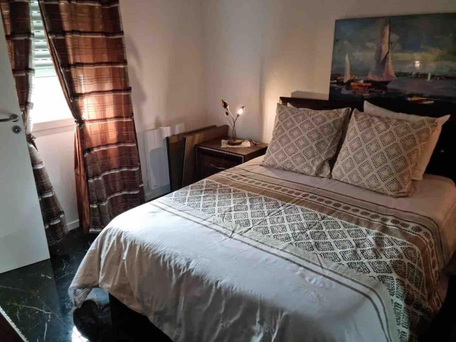 a bedroom with a large bed and a window at A louer Appartement 2 pièces à Rosny-sous- Bois in Rosny-sous-Bois