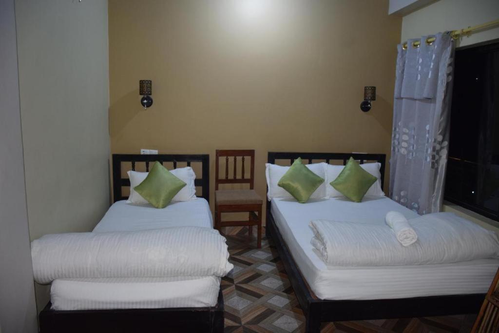Postel nebo postele na pokoji v ubytování Hotel Garangja