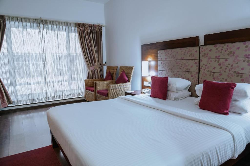 Postel nebo postele na pokoji v ubytování Hotel Devaragam by K P Namboodiri's