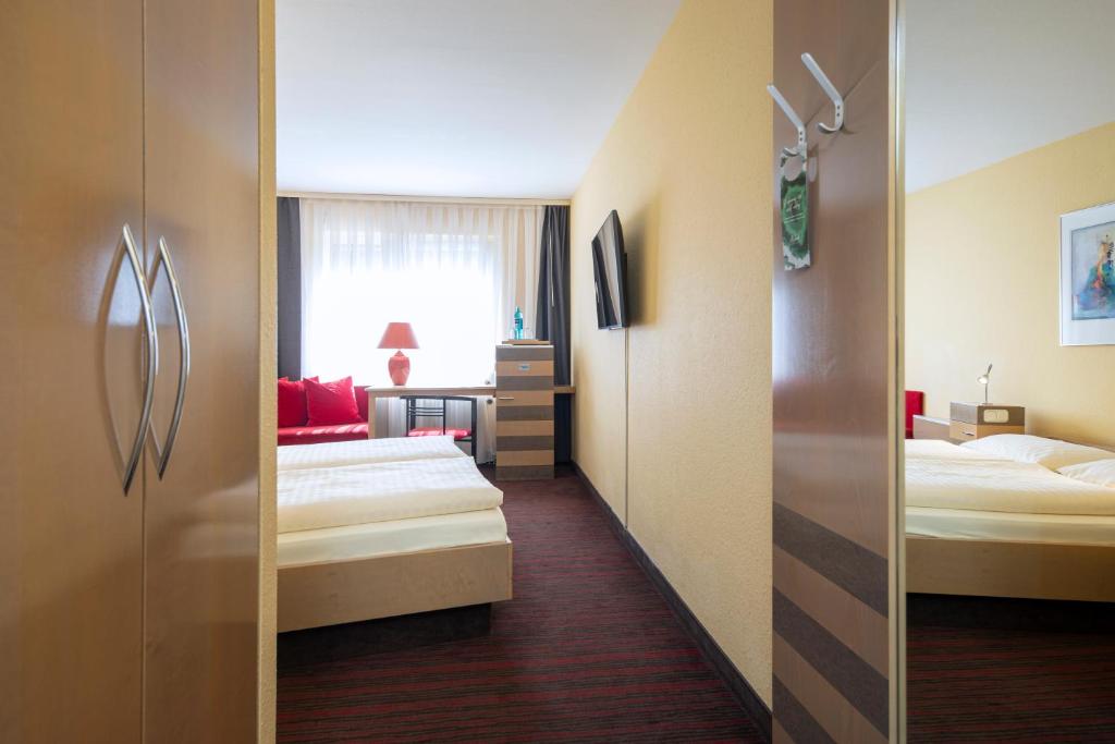 Postel nebo postele na pokoji v ubytování Roomingtons Lüneburger Heide