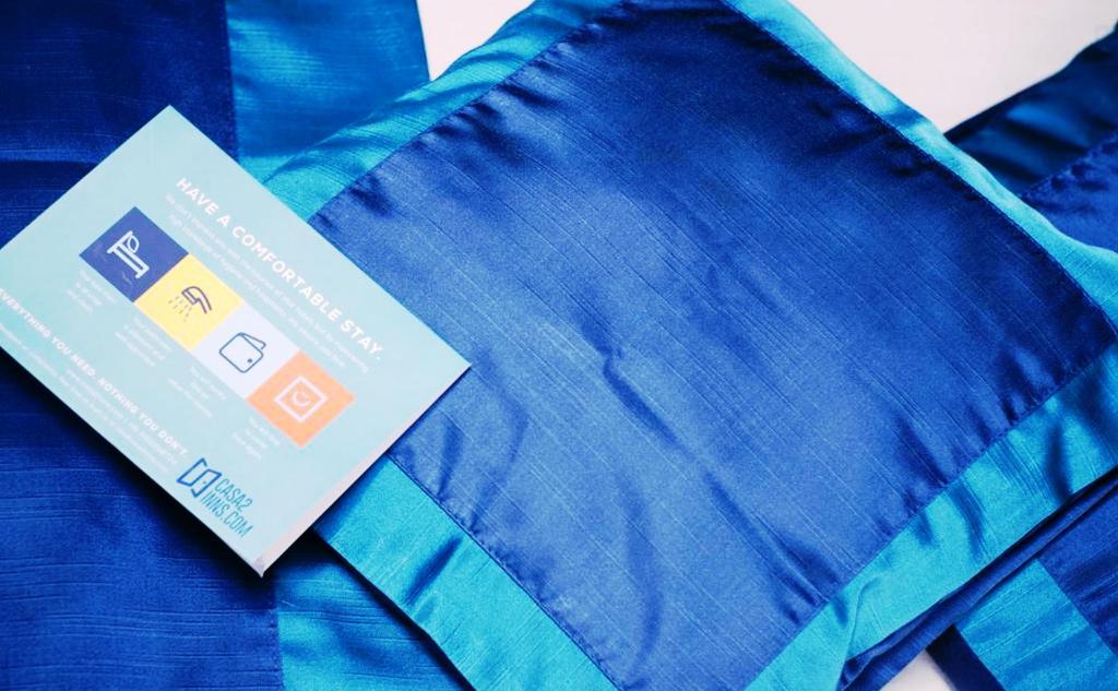 Una cama o camas en una habitación de FabHotel Prime Shree Dev Prime