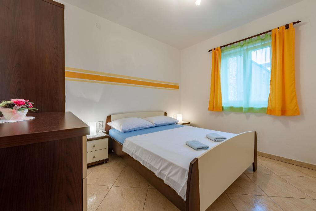 Postel nebo postele na pokoji v ubytování haus toni