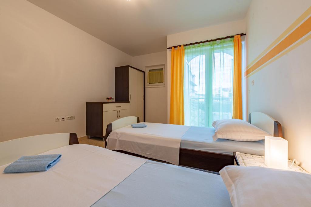 Postel nebo postele na pokoji v ubytování haus toni