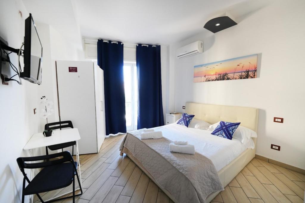 Postel nebo postele na pokoji v ubytování Holiday Garibaldi