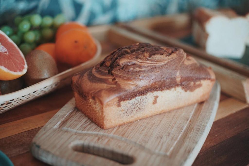 a loaf of cake on a cutting board on a table at Palm Beach in Ajaccio