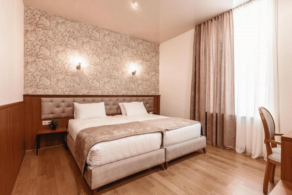 Postel nebo postele na pokoji v ubytování Park Hotel Tskaltubo - Balneo Resort