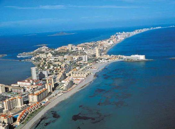 an aerial view of a city and the ocean at Chalet entre dos mares. in San Blas