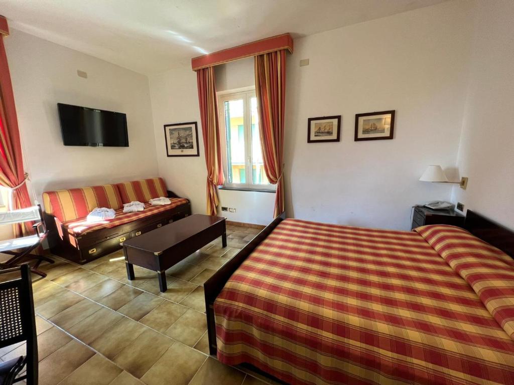 Postel nebo postele na pokoji v ubytování Hotel Clelia