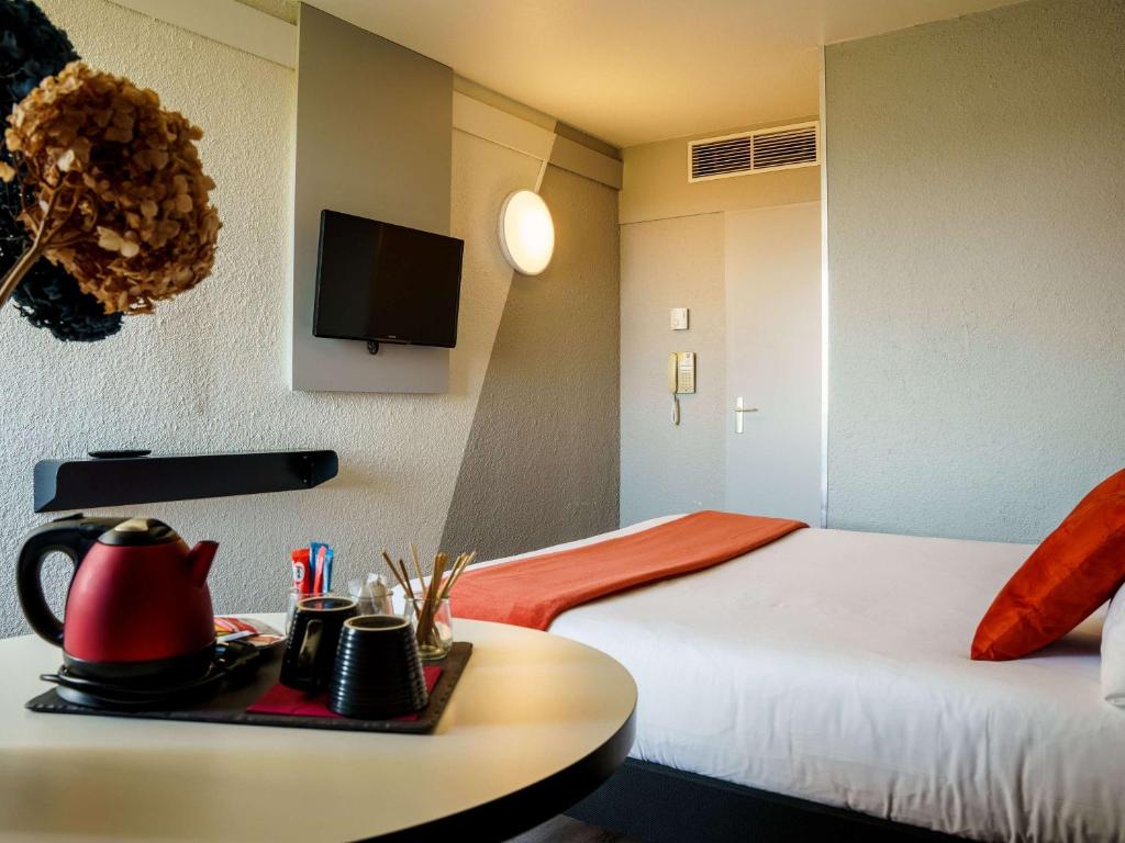 Postel nebo postele na pokoji v ubytování Ibis Alès Centre Ville