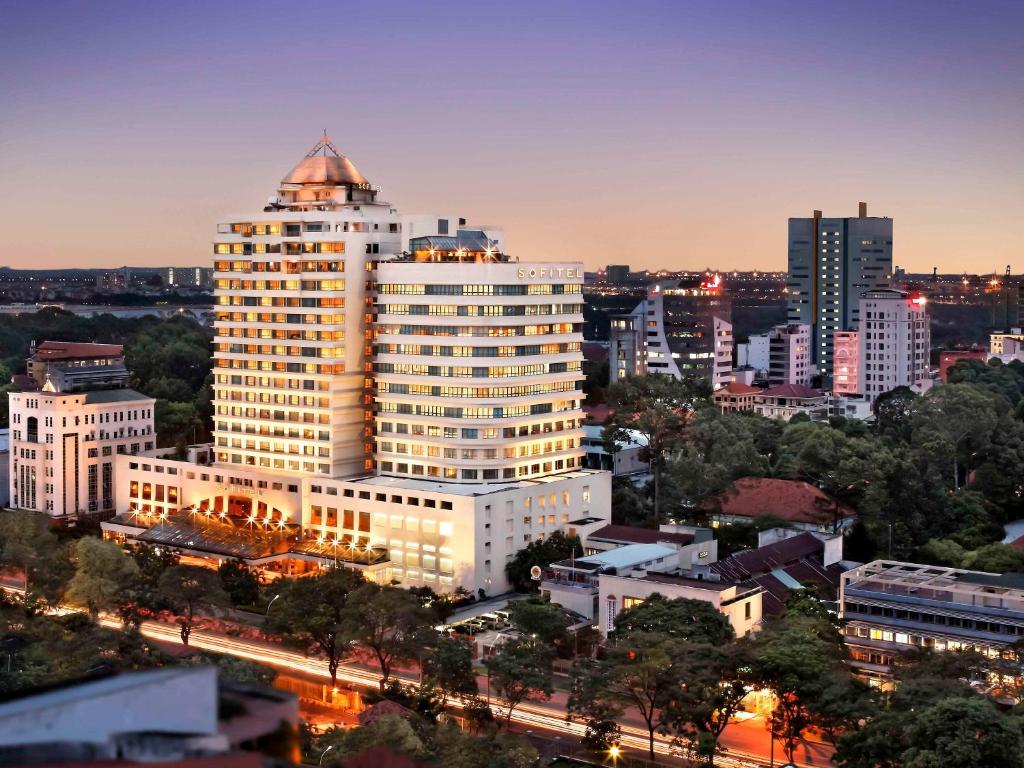 a city skyline with a tall white building at Sofitel Saigon Plaza in Ho Chi Minh City