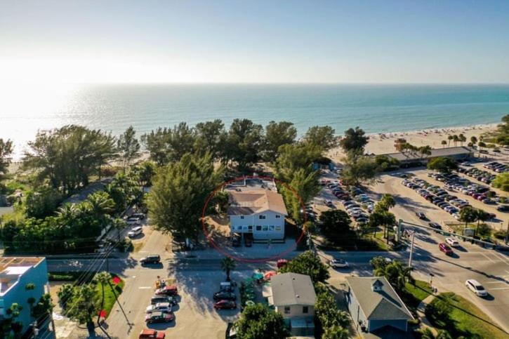 an aerial view of a parking lot next to the beach at Guld Drive House #54599 Home in Holmes Beach