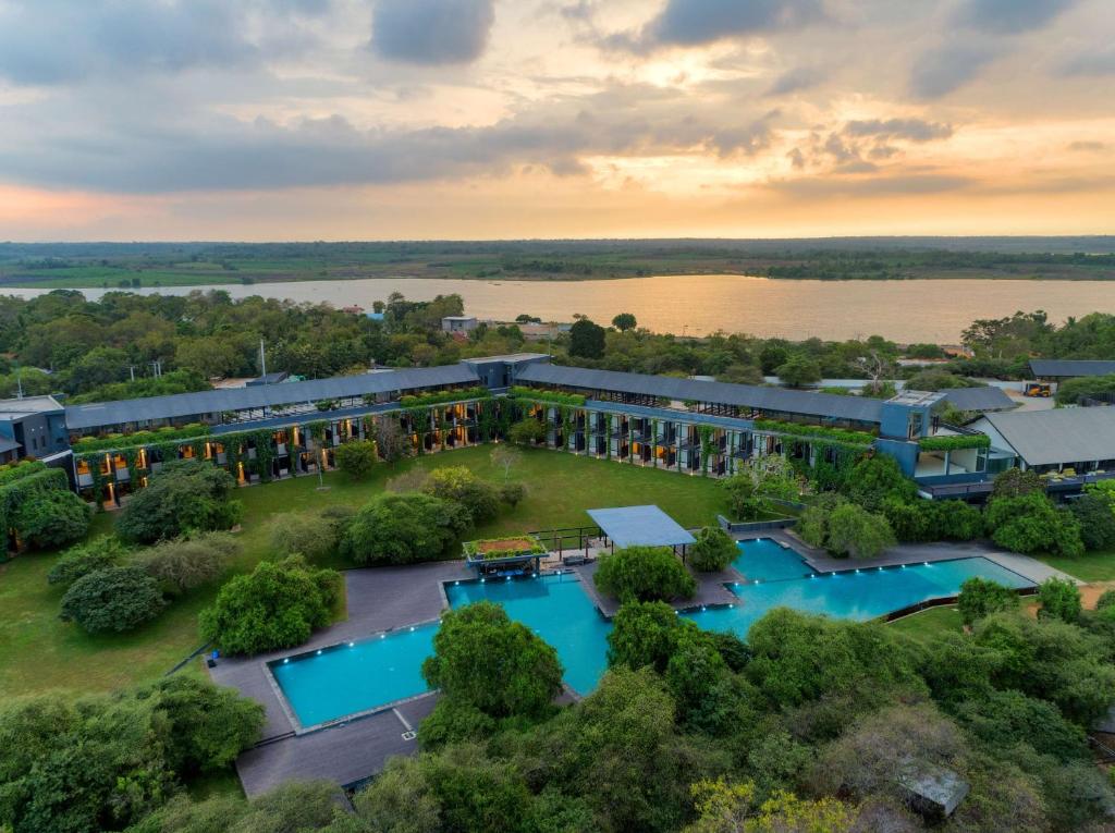 an aerial view of a resort with three pools at Doubletree By Hilton Weerawila Rajawarna Resort in Weerawila