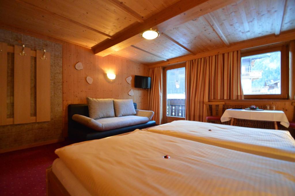 Postel nebo postele na pokoji v ubytování Apartments & Zimmer Urschnerhof