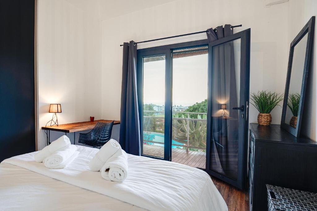 Postel nebo postele na pokoji v ubytování Villa Oasis