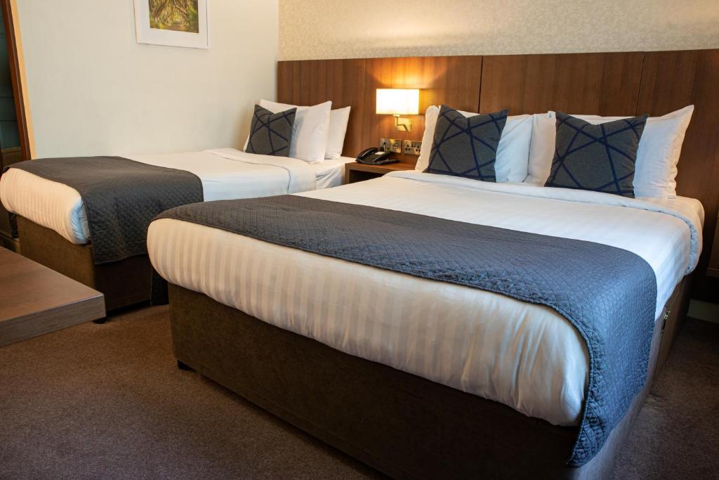 Postel nebo postele na pokoji v ubytování Arklow Bay Hotel