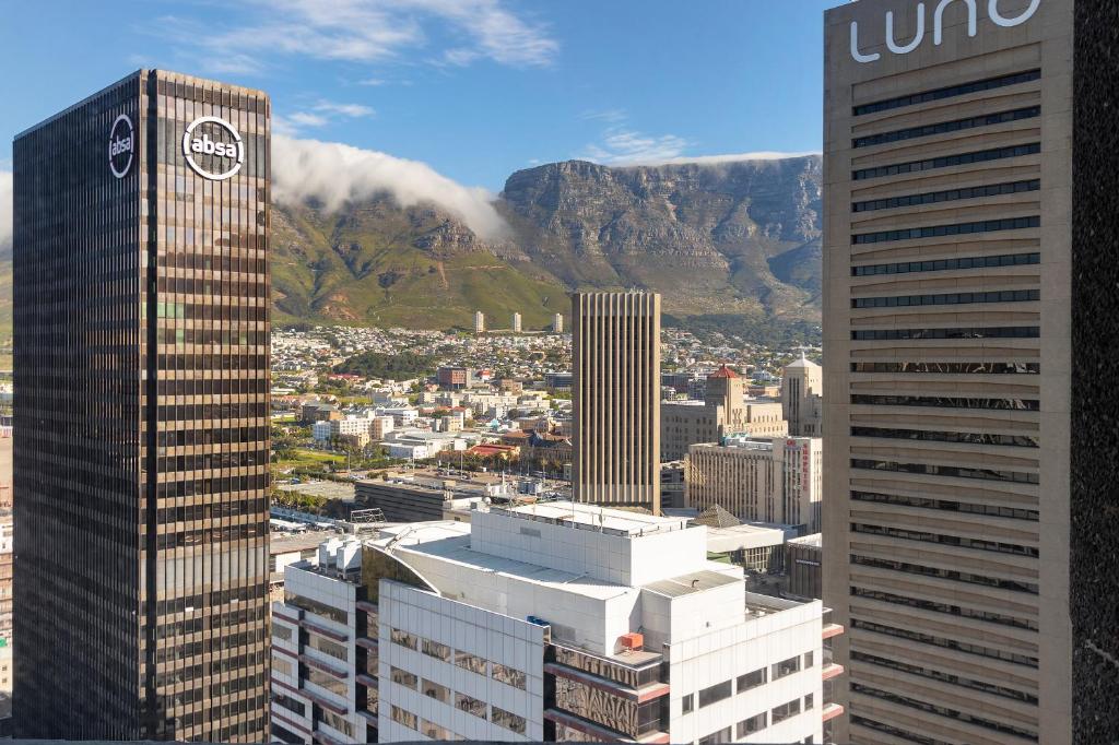 a view of a city with mountains and buildings at One Thibault 2003 in Cape Town