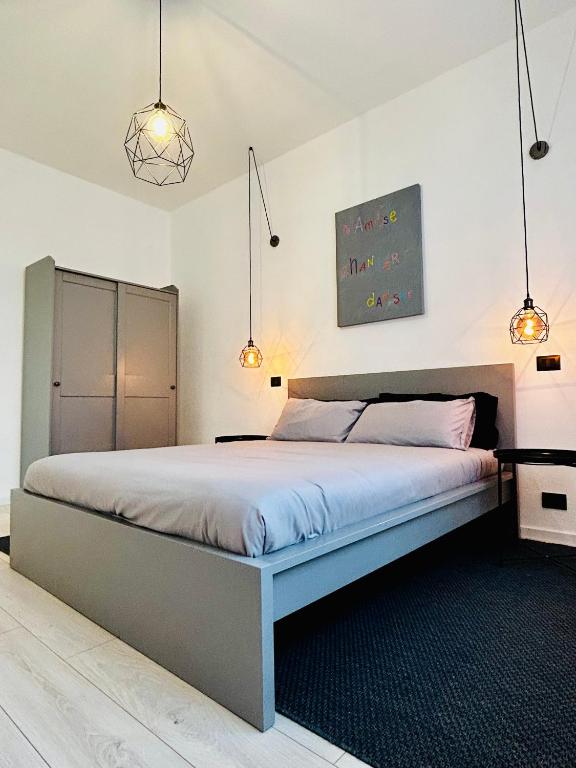Postel nebo postele na pokoji v ubytování Design Moderno in Centro - Lainate- Rho Fiera