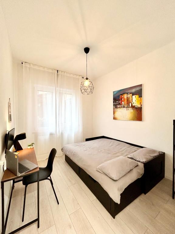 Postel nebo postele na pokoji v ubytování Design Moderno in Centro - Lainate- Rho Fiera