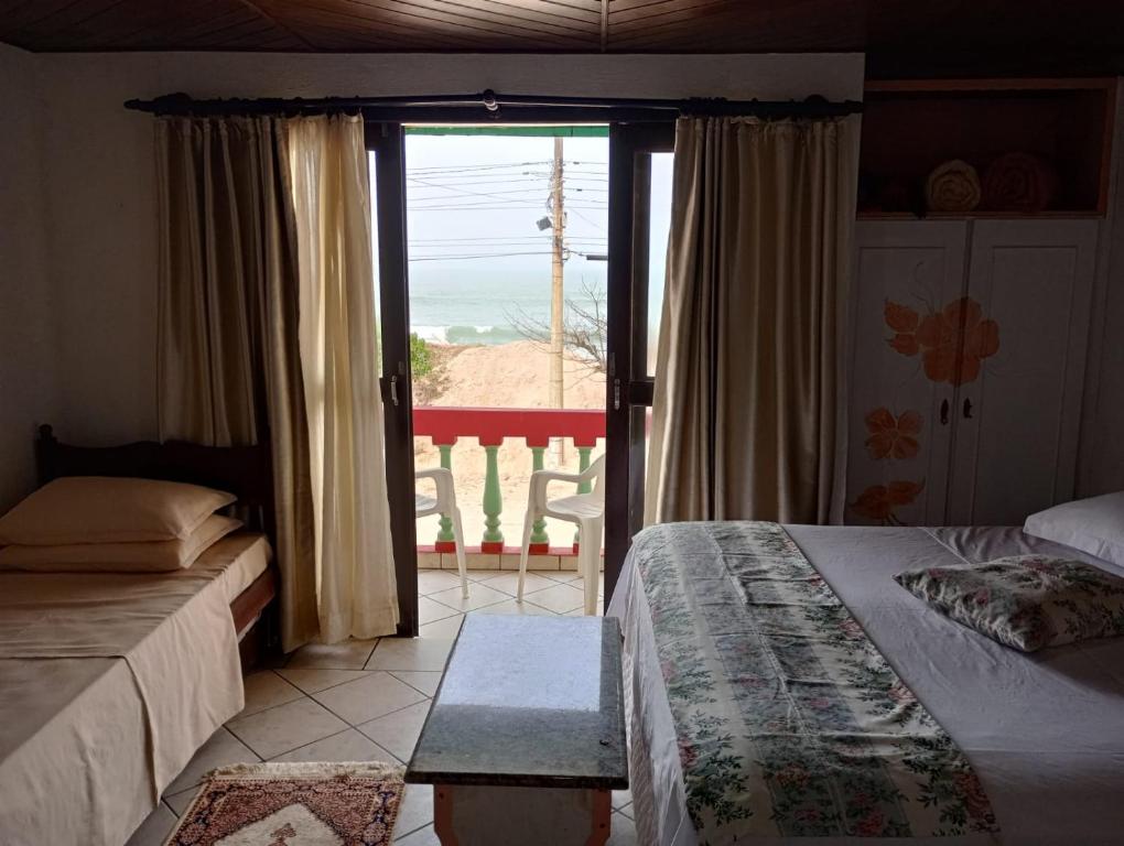 Postel nebo postele na pokoji v ubytování Pousada Kanaxuê - Frente Mar e Lagoa