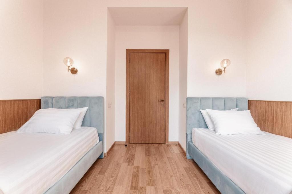 Postel nebo postele na pokoji v ubytování Park Hotel Tskaltubo - Balneo Resort