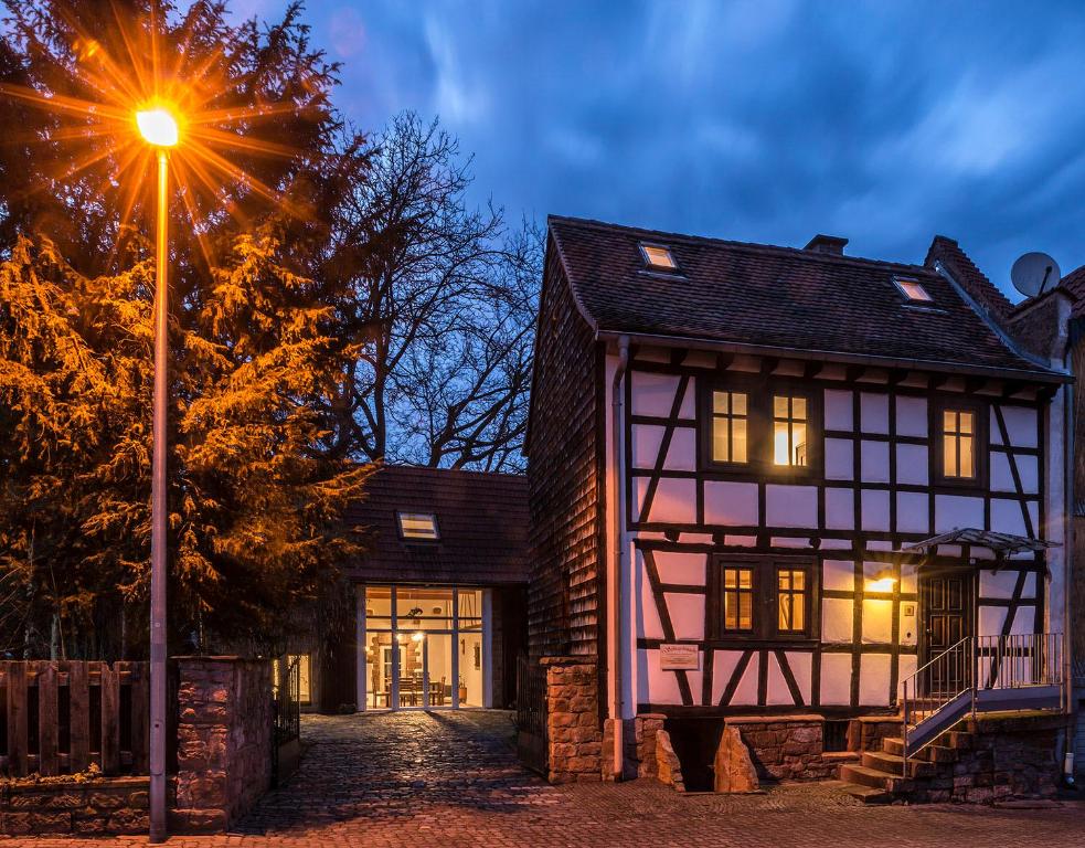 a house with a street light in front of it at Günts Lichthaus / Vestscheune in Breuberg