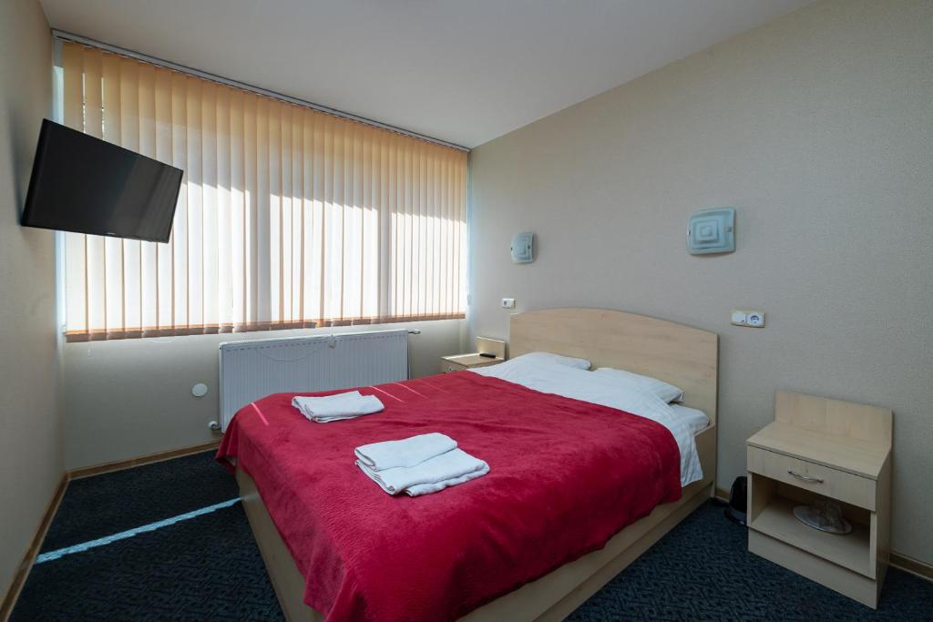Postel nebo postele na pokoji v ubytování Balvi Hotel
