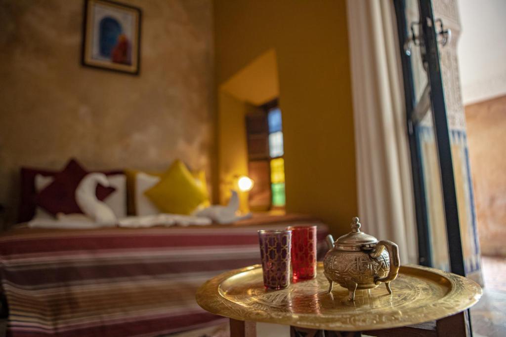 Postel nebo postele na pokoji v ubytování Riad Le Jardin de Lea, Suites & Spa