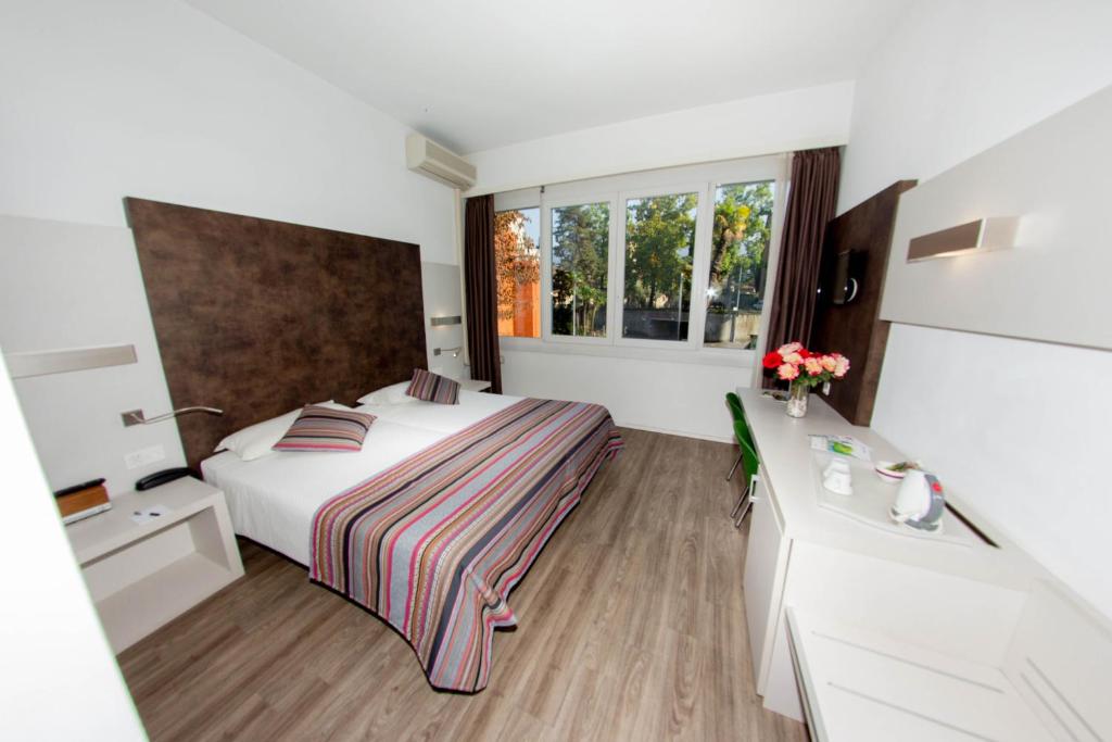 Cama o camas de una habitación en Colorado Hotel