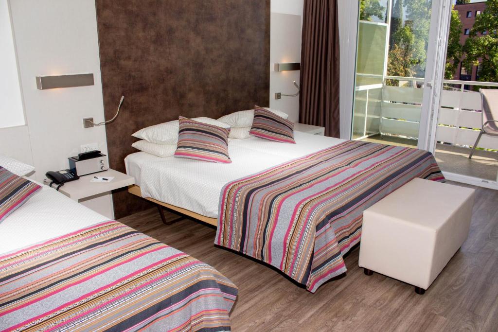 Cama o camas de una habitación en Colorado Hotel